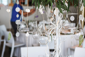 Wedding floral decorations hanging from decorative tree