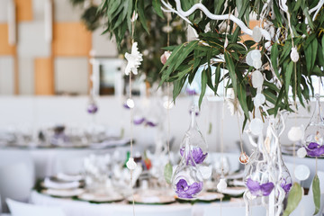 Wedding floral decorations hanging from decorative tree