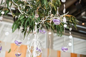 Wedding floral decorations hanging from decorative tree