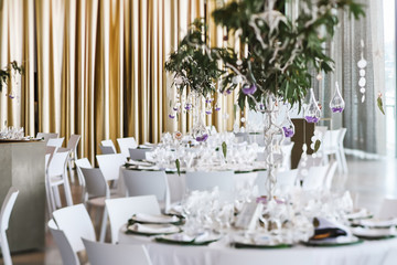Restaurant tables decorated for wedding celebration