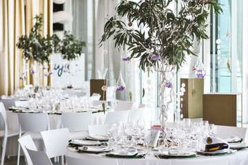 Restaurant tables decorated for wedding celebration
