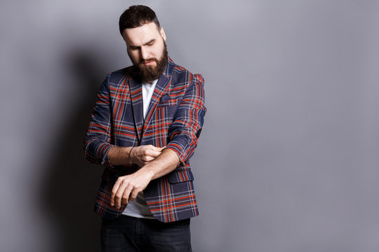 Bearded Man In Shirt Adjusting Sleeves Copy Space