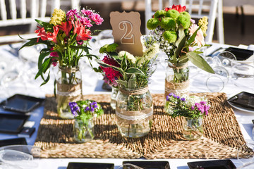 Close-up of tiny bouquets on a restaurant table