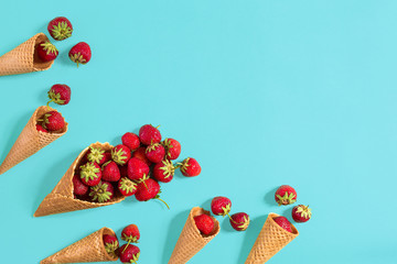 Fresh strawberry in waffle cones. Creative food concept. Flat la