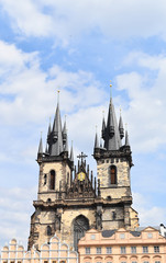 Fototapeta na wymiar Church of Our Lady before Týn in the Old Town Square in Prague, Czech Republic, with blue sky and white clouds in the background. Copy space.