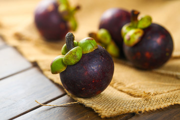 mangosteens on wooden table