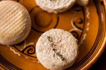 goats cheeses on a plate with lavendar