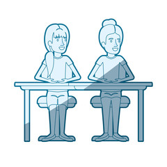 blue color silhouette shading of women sitting in desk one with collected hair and the other with ponytail hairstyle vector illustration