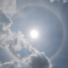 The sun halo (optical phenomena) with cloudy sky in background, natural phenomenon.