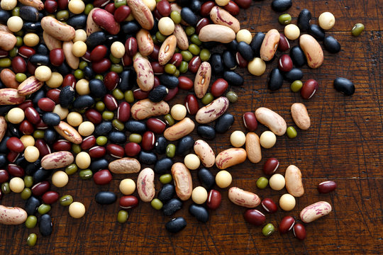 Mixed Dry Beans On Dark Wood From Above.