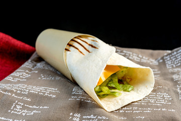 Mexican fajita wraps with grilled chicken fillet and fresh vegetables