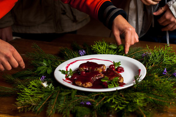 meat with fresh herbs and cherry sauce, ready to eat.
