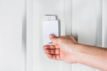 person opening door with electronic card, home security concept