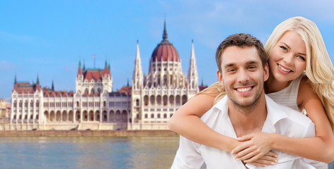 Fototapeta premium happy couple over house of parliament in budapest