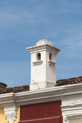 Fototapeta na wymiar Exterior detail of house in La Antigua Guatemala, wall and cupula colonial style in Guatemala, Central America.