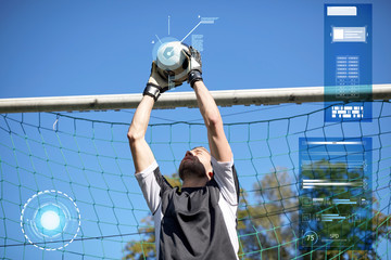 goalkeeper with ball at football goal on field