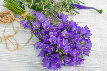 Summer bouquet of purple bell flowers top view