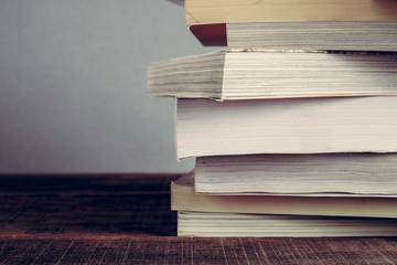 The book is on a wooden table with filter effect retro vintage style