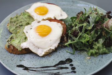 Fresh breakfest, fried eggs and salad