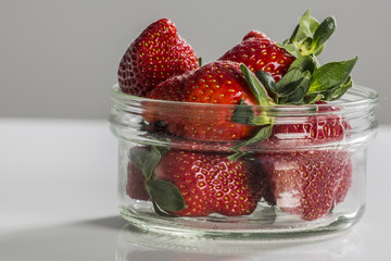 Juicy fresh strawberries in a white bowl