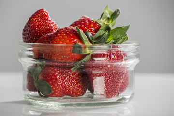 Juicy fresh strawberries in a white bowl