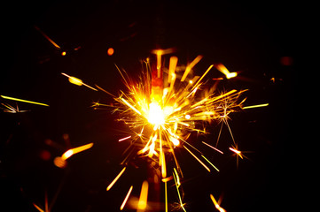 Fire Sparks With Motion Blur Effect Over Black Background