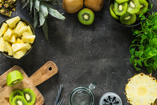 Fresh Kiwi And Pineapple As Ingredients Sliced For Smoothie. Top View, Copy Space