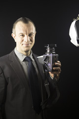 Photographer in studio in suit