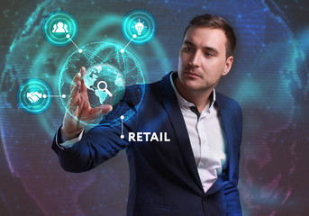 Business, Technology, Internet and network concept. Young businessman working on a virtual screen of the future and sees the inscription: Retail