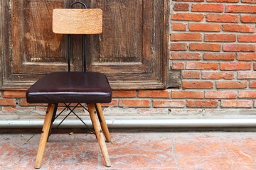 Outdoor chair on wood wall