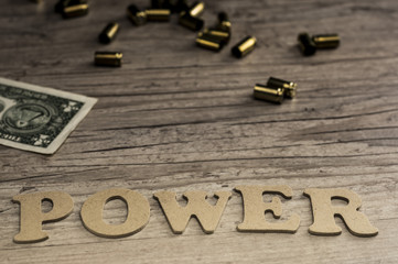 The word POWER is assembled with wooden letters