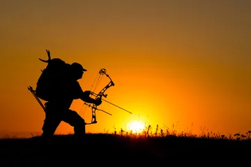 Papier Peint photo Chasser Silhouette of a bow hunter