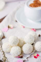 Candy and coffee on bed.