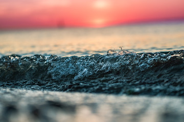 Wave at sunset