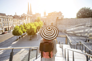 Young woman tourist enjoying great morning cityscape view with saint Andre cathedral in Bordeaux...