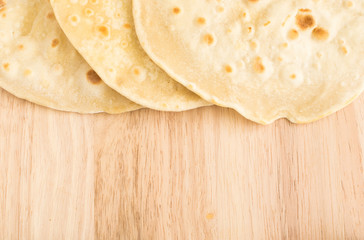 Flat Bread on a Wooden Background