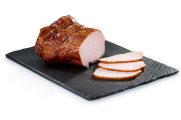 Piece of pork ham on a black stone tray  isolated on white background. Meatworks product