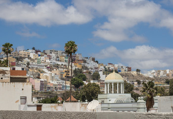 Small balconies and blue sky.