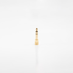 Female 3.5 mm to male TRS adapter on white background.