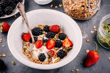 healthy breakfast bowl with homemade granola fresh blackberries and strawberries