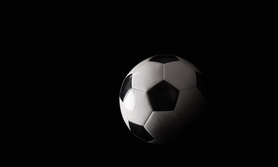 Naklejka na ściany i meble Classic soccer ball on black background.