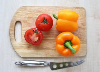 tomatoes and peppers on the Board