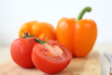 tomatoes and peppers on the Board