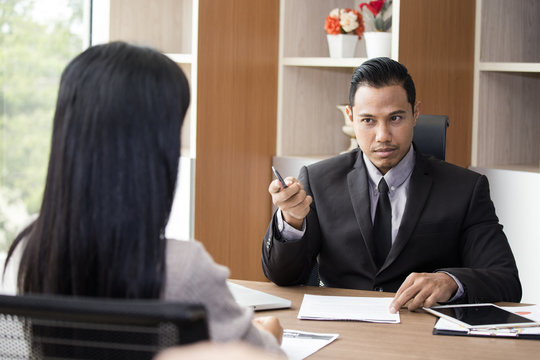 Asian man interview woman for job register with wonder feeling, man with disagree concept