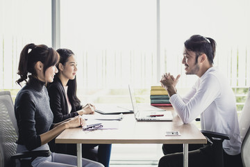 Young Buiness people talking together at office room, people interview concept.