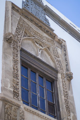 Old window with stone decorations.