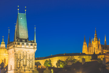 Fototapeta na wymiar Prague Castle in Mala Strana district and Charles Bridge Tower during blue hour sunset in Czech Republic