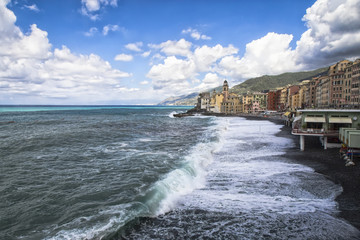 Waves breaking on the beach in Camogli, Italy