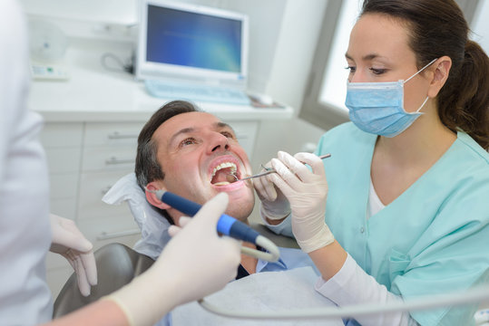 dentist treating a customer