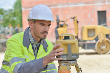 Surveyor on building site